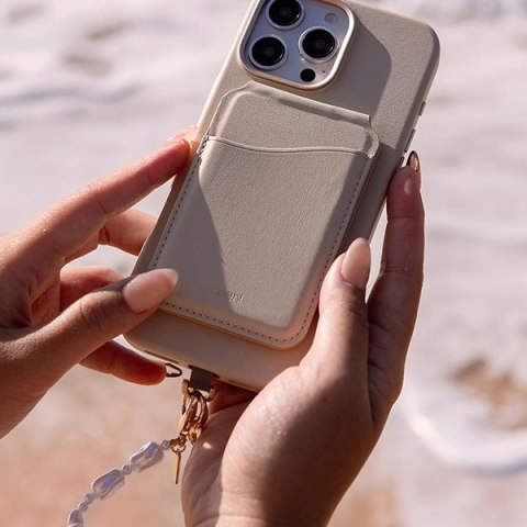 Sznurek UNIQ Coehl Perla Handstrap uniwersalny na telefonu - biały