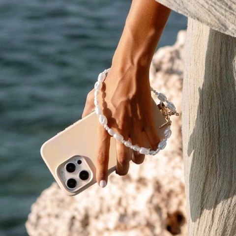 Sznurek UNIQ Coehl Perla Handstrap uniwersalny na telefonu - biały